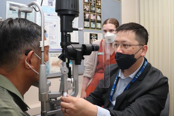 Ophthalmologist Dr George Kong and optometrist Janelle Scully assess a patient attending the Glaucoma Collaborative Care clinic.